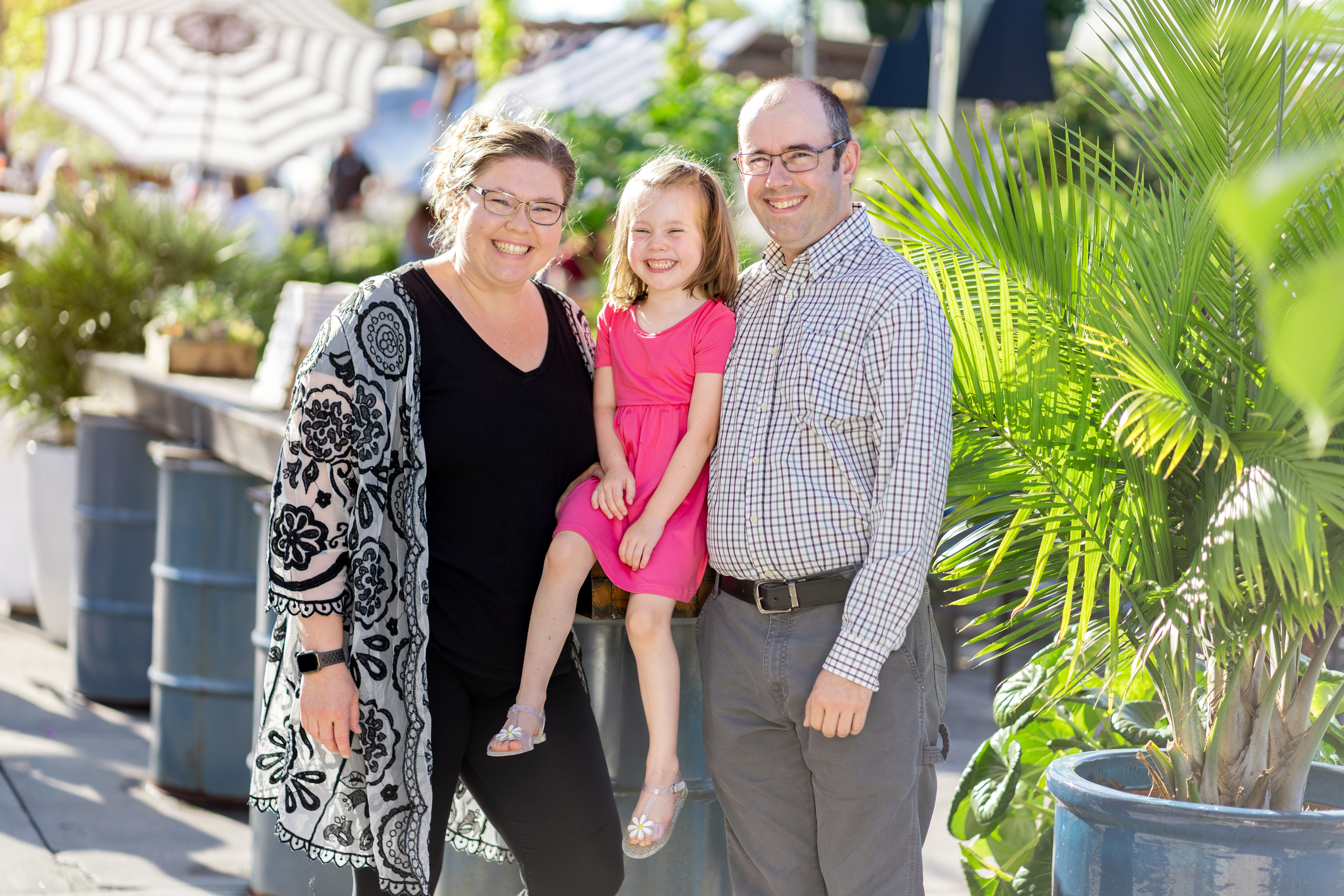 Family photo of mom, dad, and daughter